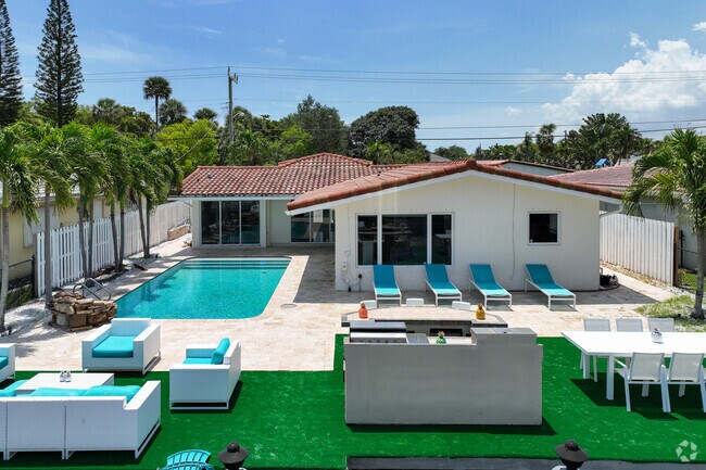 Ranch-style home with a spacious backyard and pool in the Pompano Shores neighborhood.