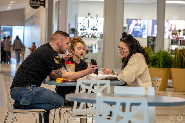 A family takes a lunch break at the food court inside Auburn Mall in Stoneville.