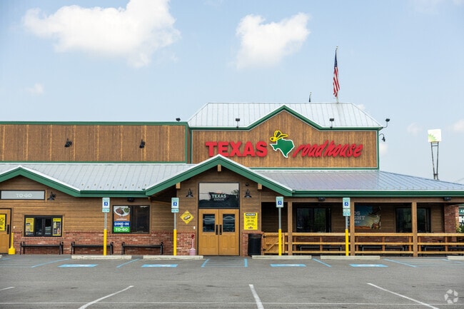 Texas Roadhouse by Green Oak Village Place shopping center.