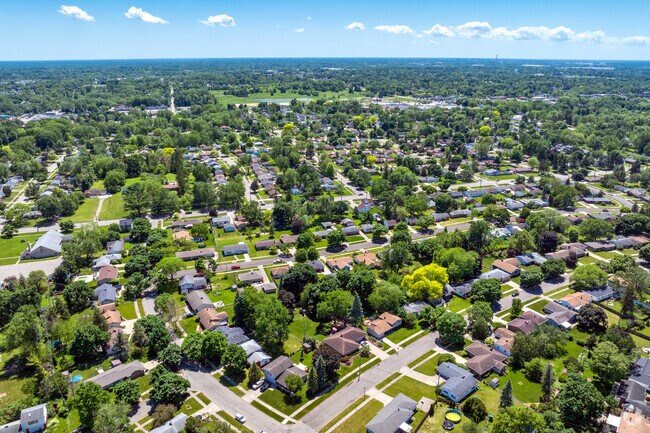 Large, well-manicured lawns and mature trees, are hallmarks of Edgemont Park.