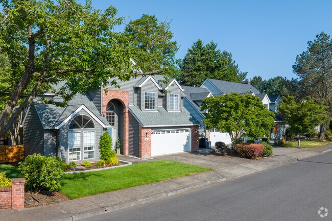 Large contemporary homes are tucked away behind brick walls along SW Partridge Drive in Lake Forest.
