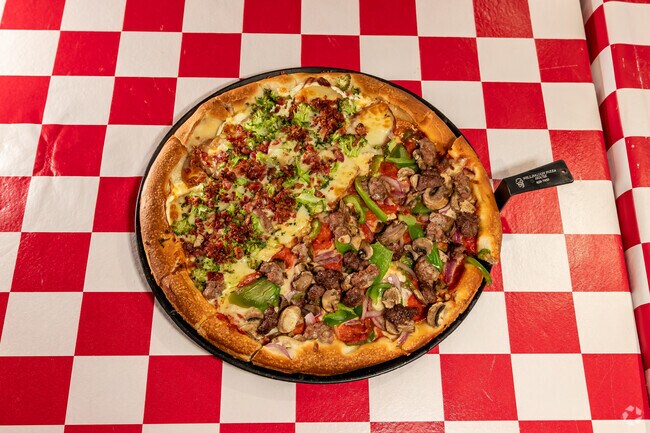 Locals enjoy the many unique specialty pies at Willington Pizza.