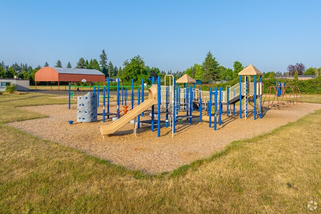 Large play structure and cover basketball courts at the Hartley Elementary School.