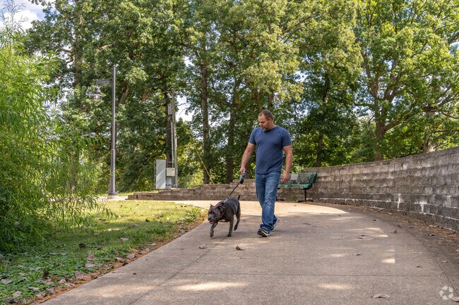 A local walks his dog at Fairview Park located just minutes from Highland Park.