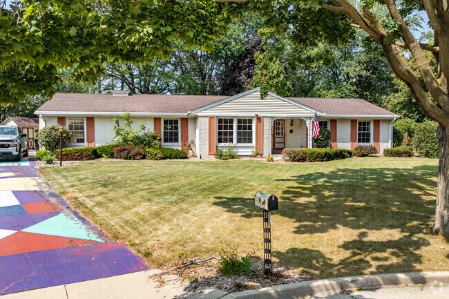 This ranch home shows off Hickory Ridge's vibrant style with a painted driveway.