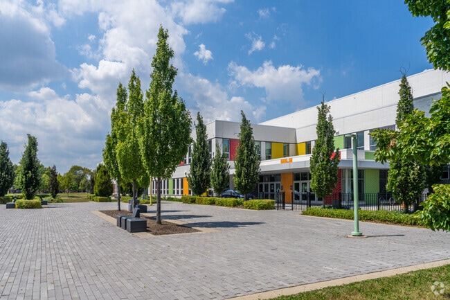 Richardson Middle School has a large outdoor area near the entrance that is well maintained.