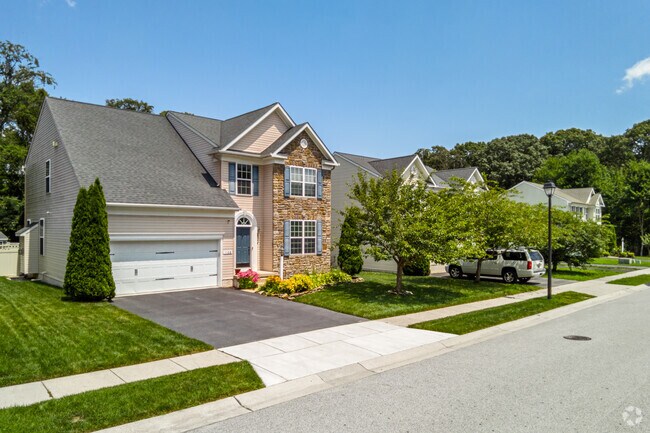 The Riviera Beach neighborhood features newer Traditional style homes with two-car garages.
