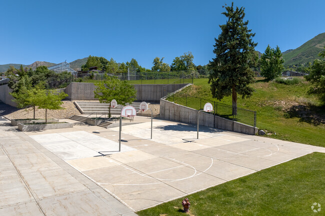 Basketball courts sit against the mountains at Hillside Middle School.