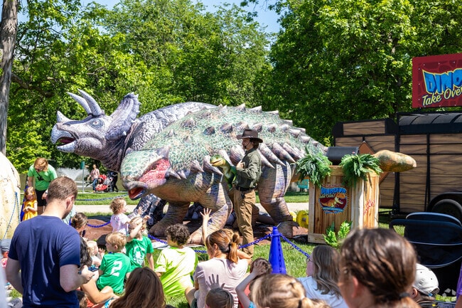 A lesson on prehistoric dinosaurs is popular at the Turkey Creek Festival.