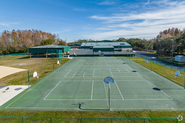 Students enjoy outdoor play on the sports courts at Trinity Oaks Elementary.