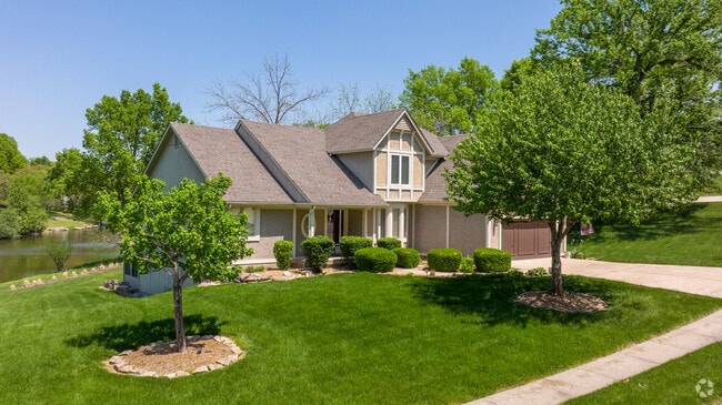 Traditional style homes in Raytown often have well-manicured lawns and may sit next to a small lake or pond.