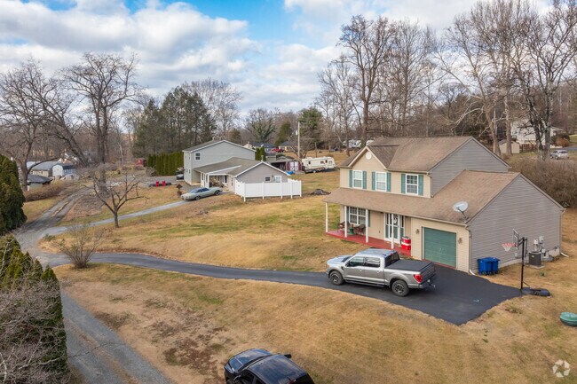 Newer colonial homes have spacious interiors and offer generous land size in Earl.