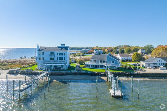 Coastal homes in Potowomut have long docks that jet out into Greenwich Bay.