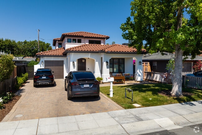 A charming Spanish-style home with a terracotta roof stands out in South of Midtown.
