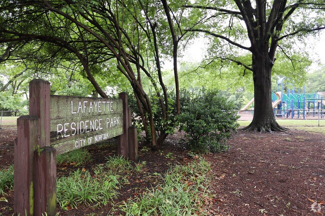 Locals enjoy shaded strolls at Lafayette Residence Park, a green gem in Lafayette-Winona.