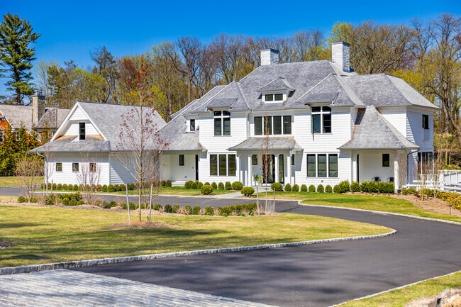 Many homes in Sands Point include thick trees in the back yard.