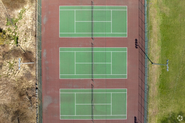 Locals can play a leisurely game of tennis at Fulton Park near North End District.