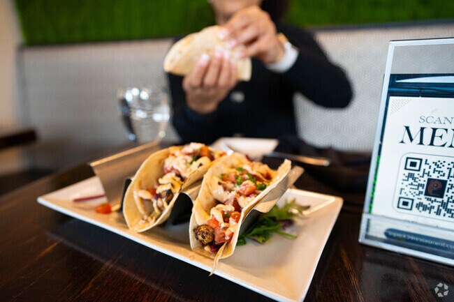 Park 54 serves jerk chicken street tacos loved by Hyde Park locals.
