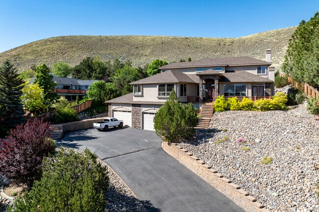 Hillside estate in Carson City Center blends modern luxury with desert landscaping and views.