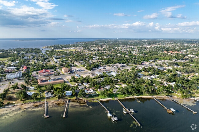 Docks on Saint Andrews Bay stretch long so that homeowners can maintain access during low tide.