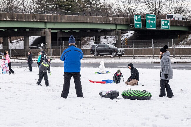 Families enjoy a little snowball fight in North Babylon.