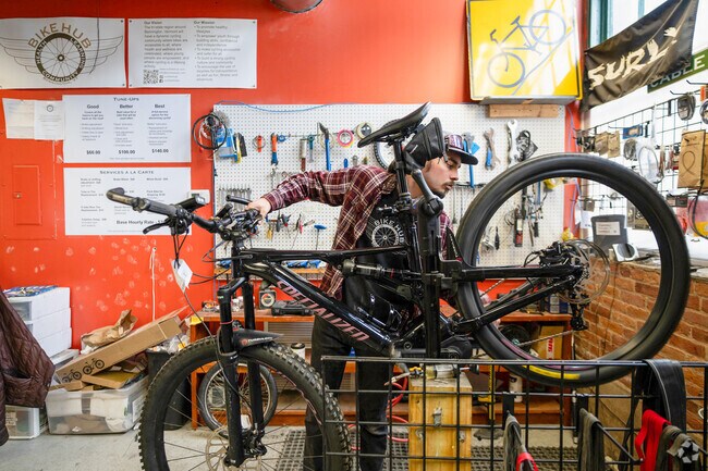 A worker at Bike Hub in Bennington repairs a mountain bike.