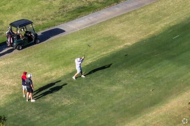 Golfer launches one down the fairway in El Macero.