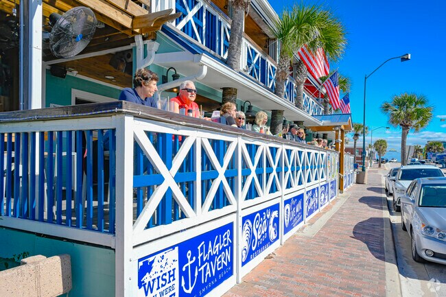 Enjoy live music and rooftop dining at Flagler Tavern in Central Beach.