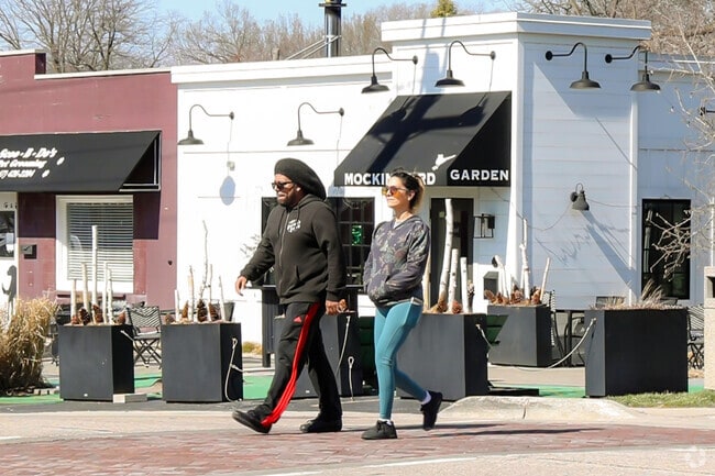 A couple strolling through East Dundee downtown.