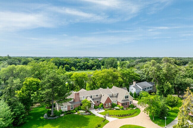 A home with red brick accents in the Rolling Green - Hilldale neighborhood.