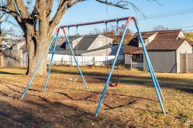 People of all ages love the swings at Violetwood Park.