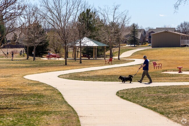 Greenway Park locals and their dogs love soaking up the sun on long walks through the trails at Ryan Park.