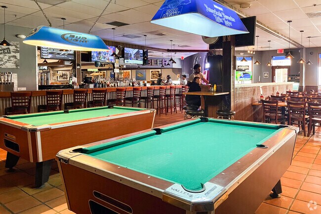 JoJo`s Seafood and Bar have pool tables ready for you in Paddock Park of Wellington neighborhood
