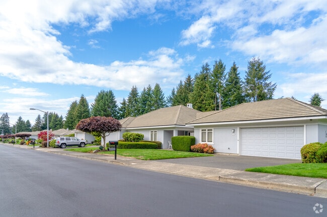 Colorful homes with front porches, blooming gardens, and friendly neighbors in Indian Summer.