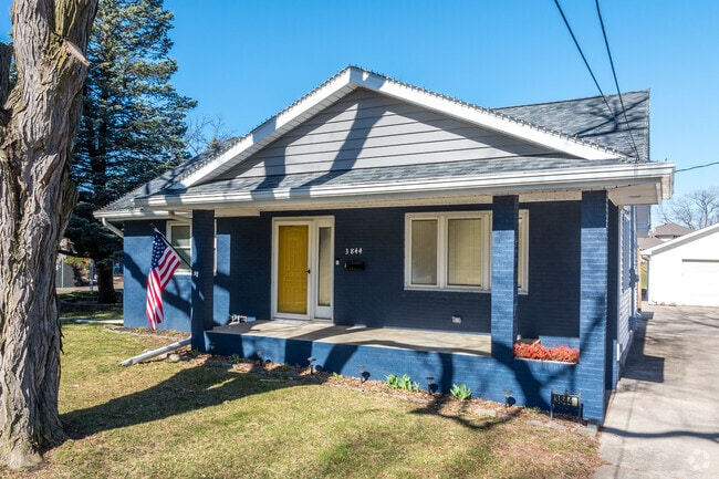 Smaller bungalow homes show off their character with pops of color and inviting front porches.