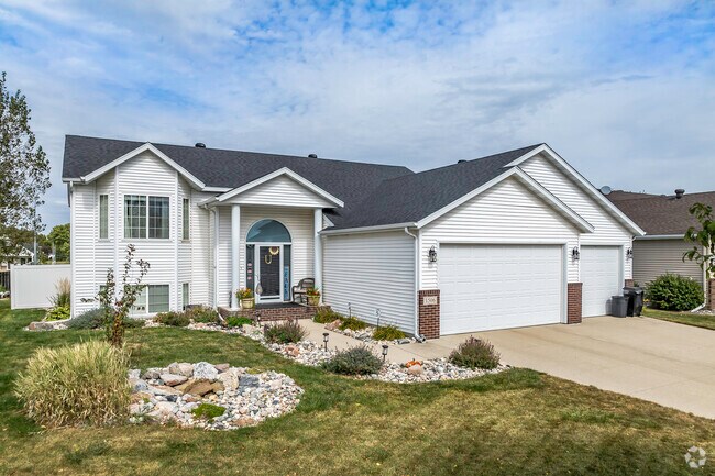 This bi-level home has a 3-car garage and nicely landscaped front yard in Arbor Glen.