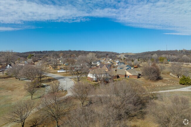Mature trees and rolling hills add to the landscape in the Gilcrease Hills neighborhood.