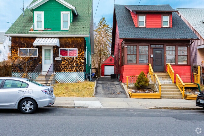 There are many different older styles of homes in Second Ave like these two.