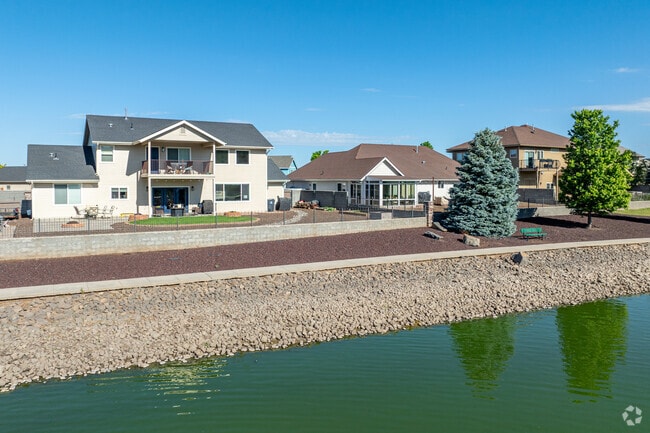 Some homes in Flagstaff Meadows overlook the local pond which is stocked with fish.