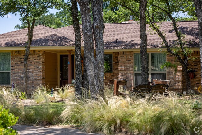 Ranch inspired homes with green lush front yards.