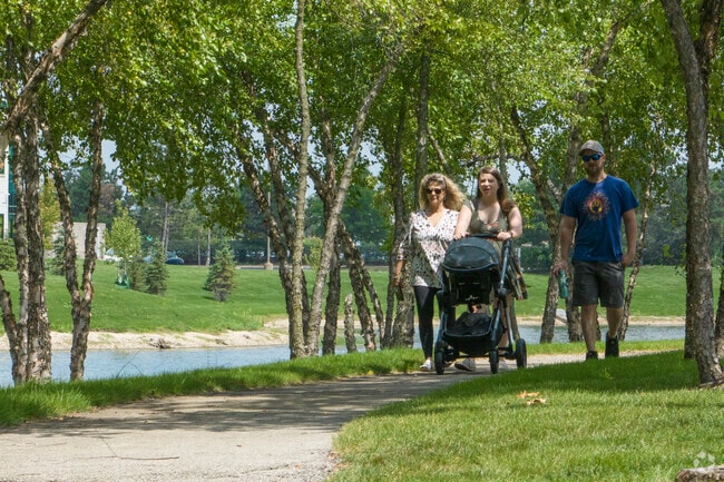 Families enjoy a stroll around the miles of paths at Fox Valley's Walker Lake.