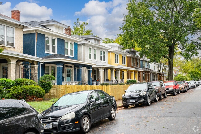 Colorful American Foursquare homes line the street of Highland Park
