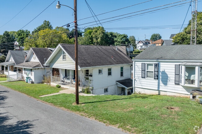 Small housing in close proximity sits along the road in Westover.