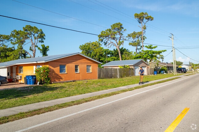 Some homes in Pine Manors have large back yards with detached garages.