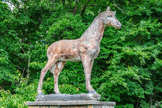 A horse statue guards the entrance to a Groometown neighborhood.