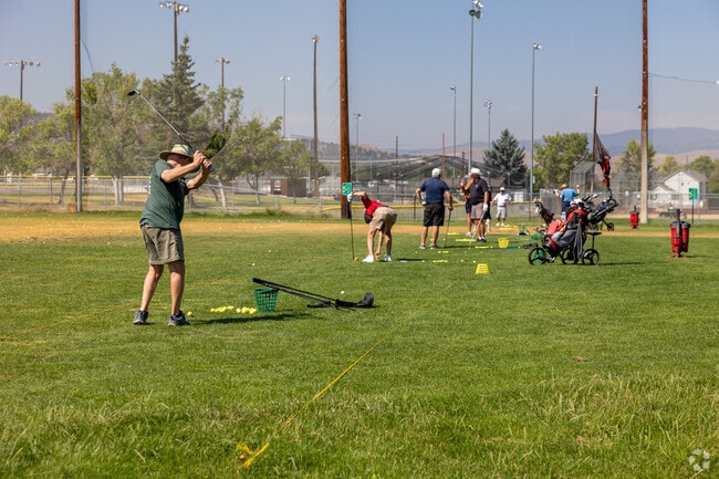Golfers practice their swing at Bill Roberts Golf Course, just north of Jefferson City.