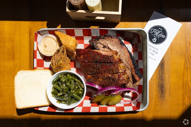 Midland locals can enjoy a mouthwatering bite of BBQ at the Half Acre.