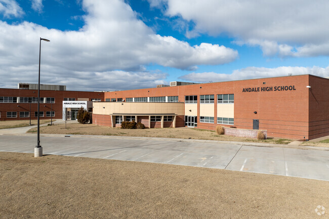The building for Andale High School is made of red brick.
