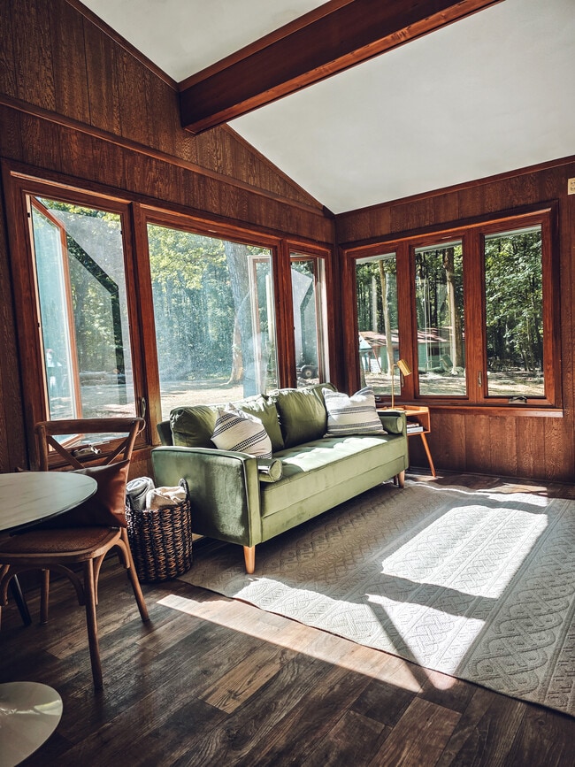 Living room with large windows and fireplace