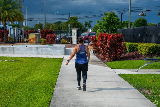 A person walks around the track at Danny Meehan Recreational Field.